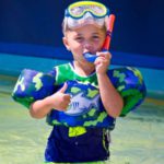 child snorkeling at Crab Island in Destin